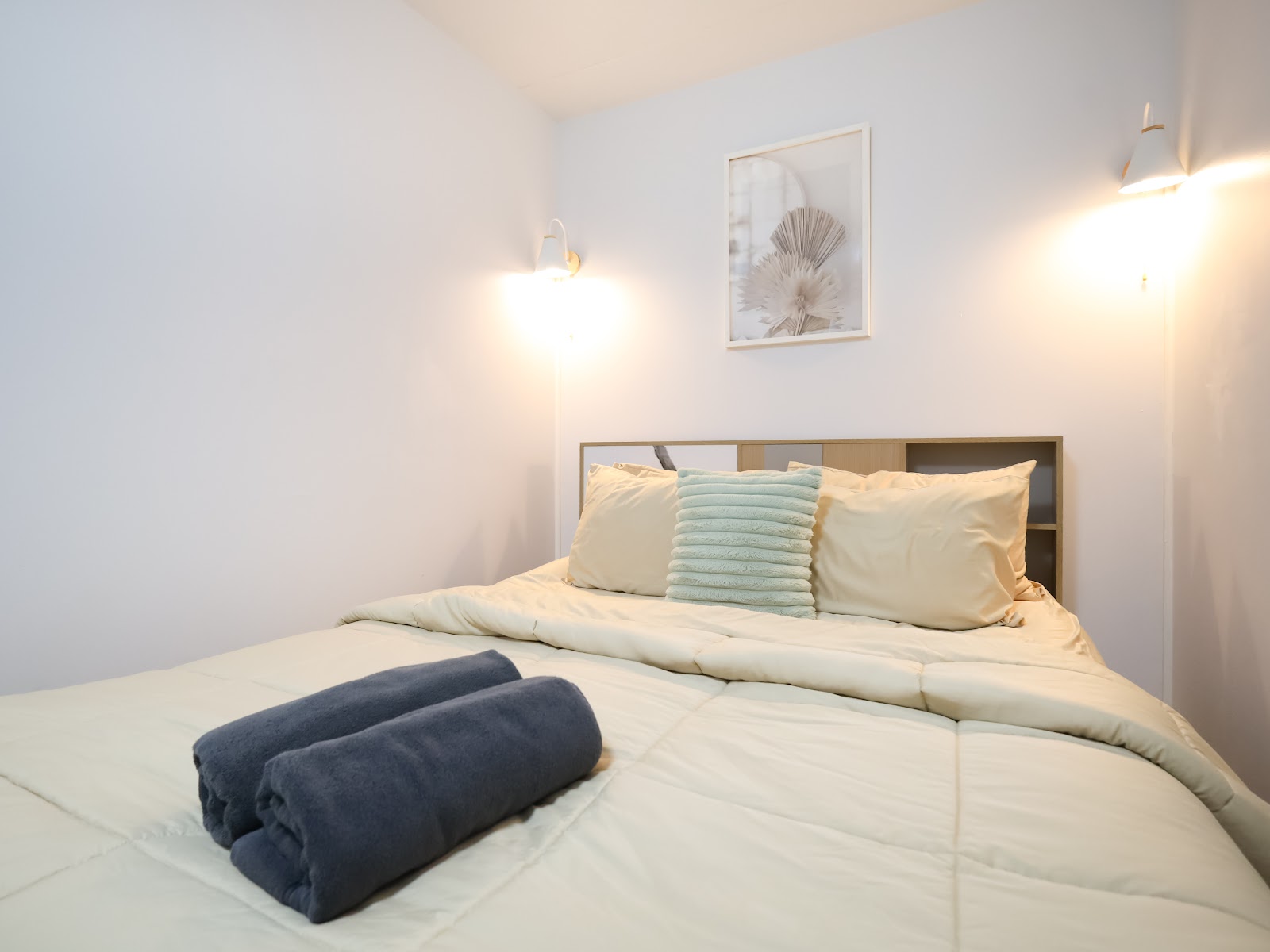 Cosy bed with reading sconces